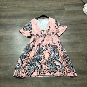 Women’s plus sized pink dress with design at bottom